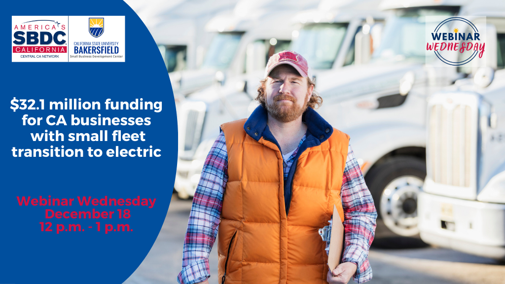 A blue collar business man holding a clipboard stands in front of his business' small fleet of white semi trucks