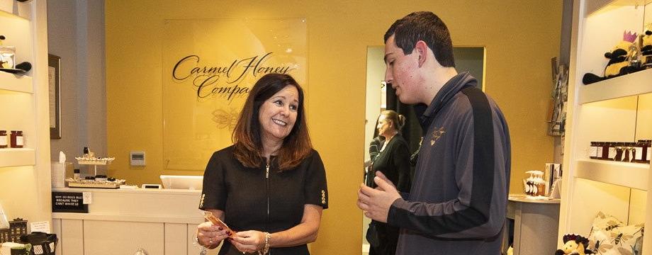 two people in honey store